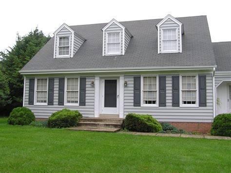 gray siding with blue shutters.